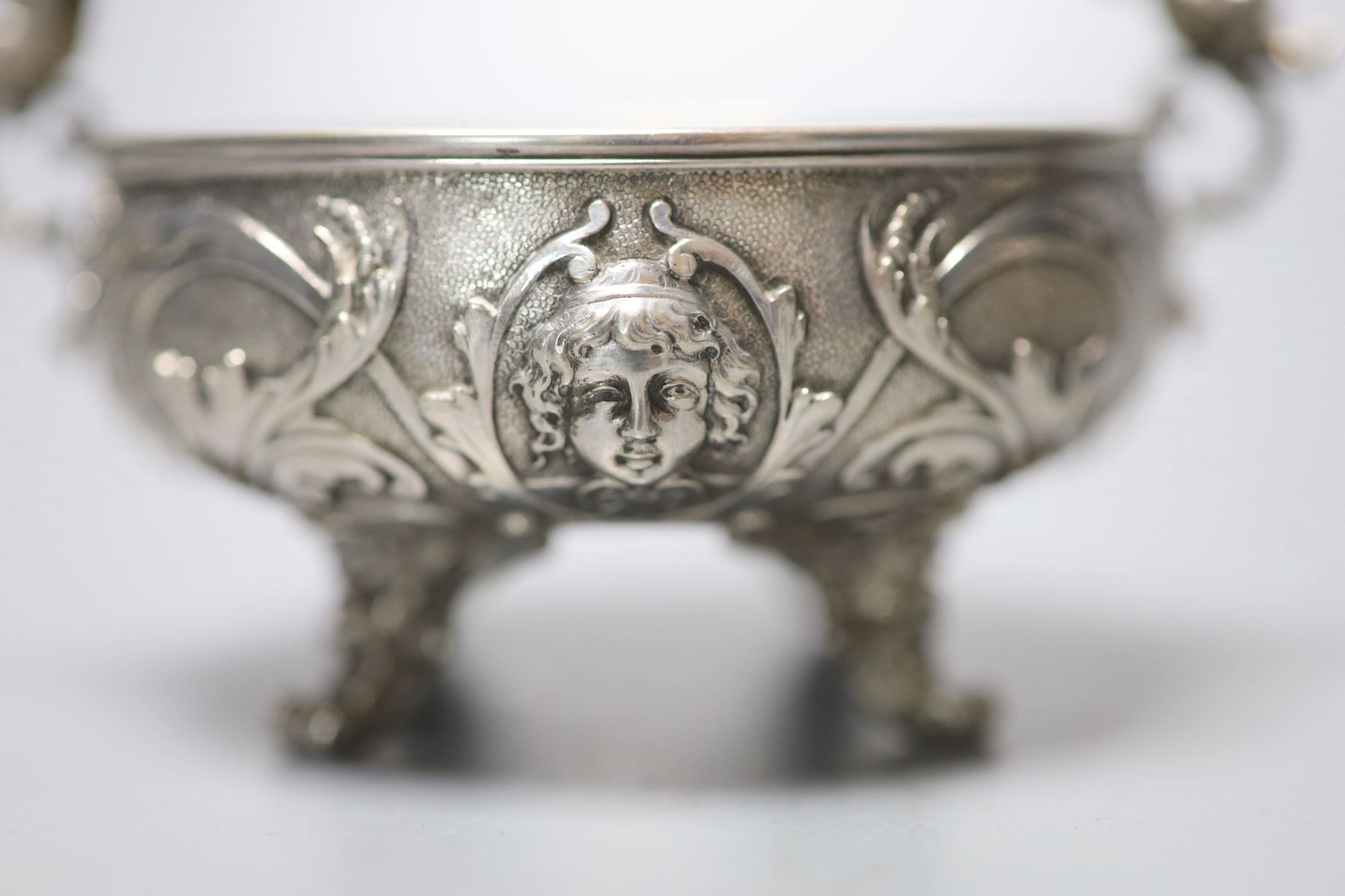 A pair of Italian white metal two handled sweetmeat bowls, by G Accarisi, with figural handles, dia. 85mm, 8oz.